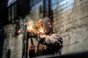 Industrial Worker welding steel